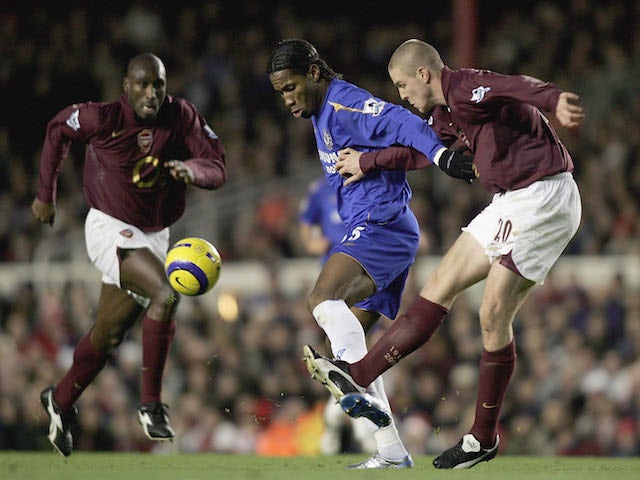 Didier Drogba of Chelsea holds back Philippe Senderos of Arsenal during the Barclays Premiership match between Arsenal and Chelsea at Highbury on December 18, 2005
