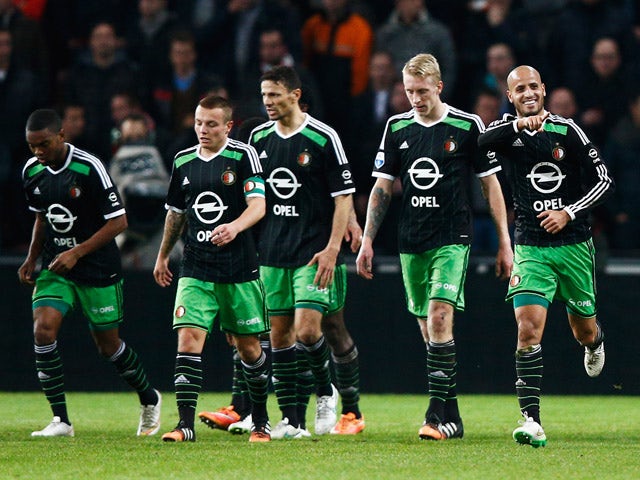 Karim El Ahmadi of Feyenoord celebrates scoring his teams second goal of the game with team mates during the Eredivisie match between PSV Eindhoven and Feyenoord Rotterdam held at the Philips Stadion on December 17, 2014