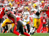 Aaron Rodgers #12 of the Green Bay Packers looks to pass against the Tampa Bay Buccaneers at Raymond James Stadium on December 21, 2014