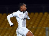 Guingamp's French midfielder Claudio Beauvue celebrates after scoring during the French League Cup football match Arles-Avignon vs Guigamp, on December 17, 2014