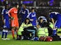 John Terry of Chelsea talks to medical staff as they treat Kurt Zouma of Chelsea during the Capital One Cup Quarter-Final match against Derby on December 16, 2014