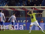 Hospitalet's midfielder Alex Barrera celebrates a goal's teammate during the Spanish Copa del Rey (King's Cup) round of 32 second leg football match Club Atletico de Madrid vs CE L'Hospitalet at the Vicente Calderon stadium in Madrid on December 18, 2014