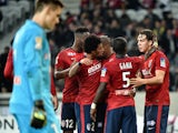 Lille's Swiss forward Michael Frey is congratulated by teammates after scoring during the French League Cup football match Lille vs Bordeaux on December 17, 2014