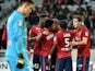 Lille's Swiss forward Michael Frey is congratulated by teammates after scoring during the French League Cup football match Lille vs Bordeaux on December 17, 2014