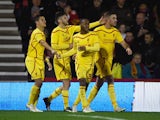 Raheem Sterling of Liverpool celebrates scoring his team's third goal with team mates during the Capital One Cup Quarter-Final match between Bournemouth and Liverpool at Goldsands Stadium on December 17, 2014