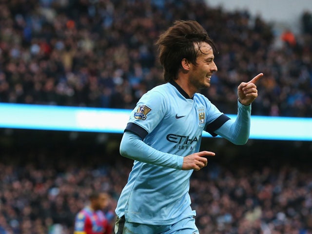David Silva of Manchester City celebrates scoring his team's second goal during the Barclays Premier League match between Manchester City and Crystal Palace at Etihad Stadium on December 20, 2014