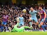 Manchester City's Argentinian defender Pablo Zabaleta chips the ball over Crystal Palace's Argentinian goalkeeper Julian Speroni but the shot goes narrowly wide during the English Premier League football match between Manchester City and Crystal Palace at