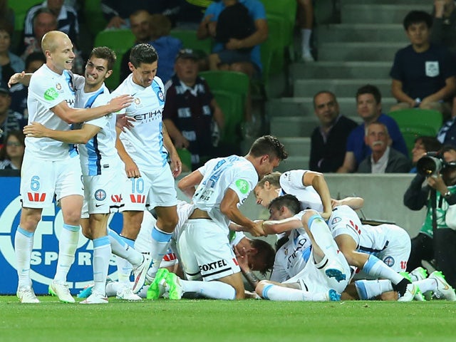 Melbourne City players celebrate a goal during the round 12 A-League match between Melbourne City FC and Melbourne Victory at AAMI Park on December 20, 2014