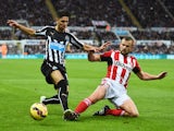 Ayoze Perez of Newcastle United is challenged by Lee Cattermole of Sunderland during the Barclays Premier League match between Newcastle United and Sunderland at St James' Park on December 21, 2014