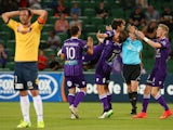 Daniel de Silva of the Glory celebrates with team mates after scoring the teams 4th goal during the round 12 A-League match between Perth Glory and Central Coast Mariners at nib Stadium on December 20, 2014
