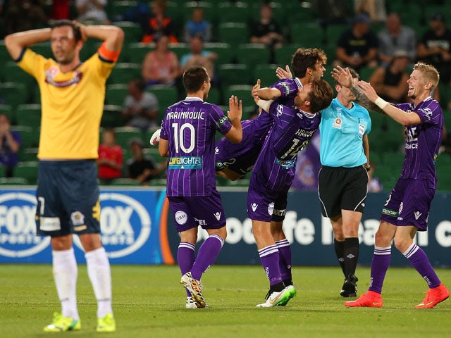 Daniel de Silva of the Glory celebrates with team mates after scoring the teams 4th goal during the round 12 A-League match between Perth Glory and Central Coast Mariners at nib Stadium on December 20, 2014