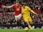 Manchester United's English defender Phil Jones vies with Liverpool's English midfielder Adam Lallana during the English Premier League football match between Manchester United and Liverpool at Old Trafford in Manchester, north west England, on December 1