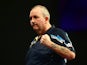 Phil Taylor of England celebrates winning his first round match against Jyhan Artut of Germany on Day Two of the William Hill PDC World Darts Championships at Alexandra Palace on December 19, 2014
