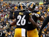 Le'Veon Bell #26 celebrates his touchdown with Ramon Foster #73 of the Pittsburgh Steelers during the second quarter against the Kansas City Chiefs at Heinz Field on December 21, 2014
