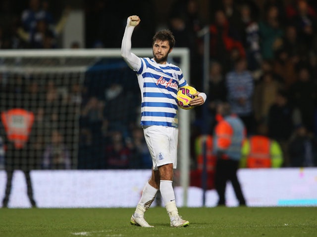 Charlie Austin of QPR celebrates victory after his three goals during the Barclays Premier League match between Queens Park Rangers and West Bromwich Albion at Loftus Road on December 20, 2014
