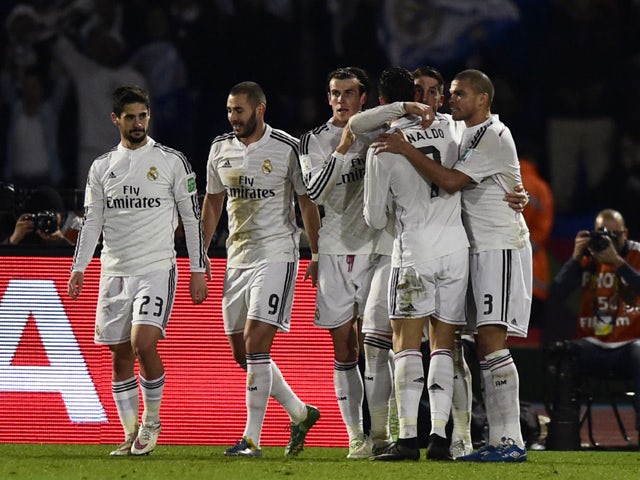 Real Madrid's players congratulate their teammate Sergio Ramos after he scored a goal against San Lorenzo during their FIFA Club World Cup final football match at the Marrakesh stadium in the Moroccan city of Marrakesh on December 20, 2014