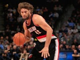 Robin Lopez #42 of the Portland Trail Blazers controls the ball against the Denver Nuggets at Pepsi Center on November 12, 2014