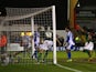 Ellis Deeney of Worcester City looks on as the players of Scunthorpe United celebrate the opening goal during the FA Cup Second Round Replay match between Worcester City and Scunthorpe United at Aggborough Stadium on December 17, 2014