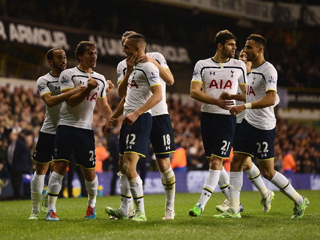Nabil Bentaleb of Tottenham Hotspur celebrates scoring the opening goal with team mates during the Capital One Cup Quarter-Final match between Tottenham Hotspur and Newcastle United at White Hart Lane on December 17, 2014