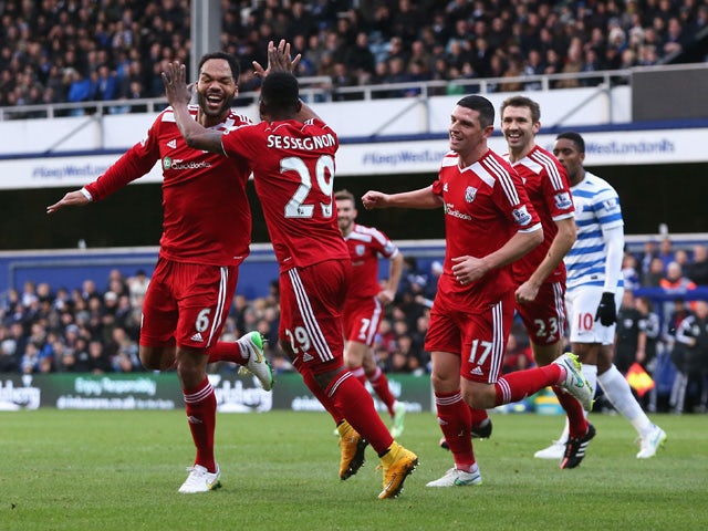 Joleon Lescott of West Brom celebrates scoring the opening goal during the Barclays Premier League match between Queens Park Rangers and West Bromwich Albion at Loftus Road on December 20, 2014