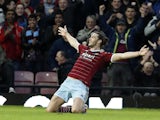 West Ham United's English striker Andy Carroll celebrates scoring the opening goal of the English Premier League football match between West Ham United and Leicester City at the Boleyn Ground, Upton Park, in east London, on December 20, 2014