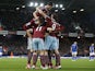 West Ham United's English midfielder Stewart Downing celebrates with teammates after scoring their second goal during the English Premier League football match between West Ham United and Leicester City at the Boleyn Ground, Upton Park, in east London, on