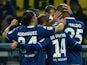 Wolfsburg's players celebrate during the German First division Bundesliga football match Borussia Dortmund v VfL Wolfsburg in Dortmund, Germany, on December 17, 2014