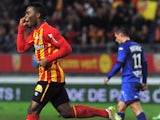 Lens' French midfielder Wylan Cyprien (L) jubilates after scoring a goal during the French L1 football match Lens (RCL) vs Nice (OGCN) on December 19, 2014