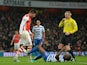 Queens Park Rangers' English defender Nedum Onuoha goes down after a confrontation with Arsenal's French striker Olivier Giroud in front of referee Martin Atkinson (C) after which Giroud is sent off during the English Premier League football match between