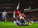Rio Ferdinand of QPR tackles Danny Welbeck of Arsenal during the Barclays Premier League match between Arsenal and Queens Park Rangers at Emirates Stadium on December 26, 2014