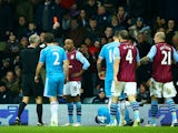 Fabian Delph of Aston Villa receives a red card from referee Martin Atkinson during the Barclays Premier League match between Aston Villa and Sunderland at Villa Park on December 28, 2014