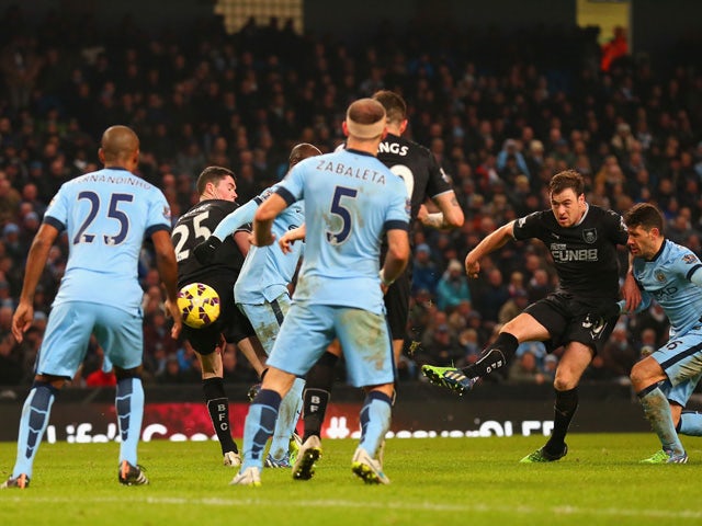 Ashley Barnes of Burnley scores their second goal during the Barclays Premier League match between Manchester City and Burnley at Etihad Stadium on December 28, 2014
