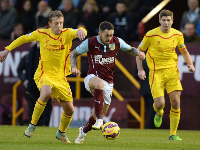 Burnley's English striker Danny Ings vies for the ball with Liverpool's Brazilian midfielder Lucas Leiva during the English Premier League football match between Burnley and Liverpool at Turf Moor in Burnley, north west England, on December 26, 2014