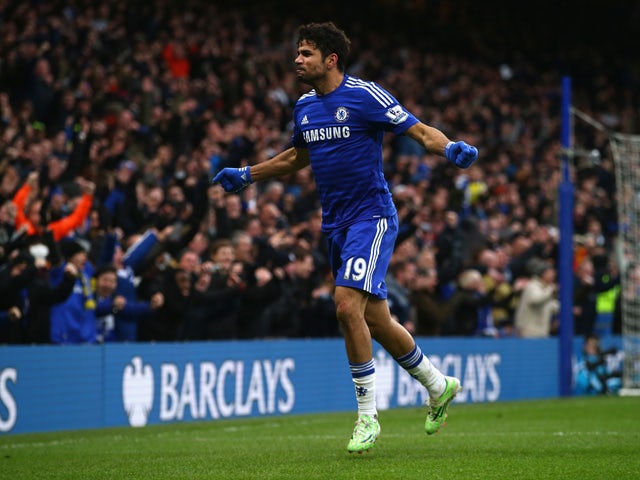 Diego Costa of Chelsea celebrates scoring their second goal during the Barclays Premier League match between Chelsea and West Ham United at Stamford Bridge on December 26, 2014