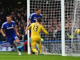 John Terry of Chelsea turns to celebrate after scoring the opening goal past Adrian of West Ham during the Barclays Premier League match between Chelsea and West Ham United at Stamford Bridge on December 26, 2014