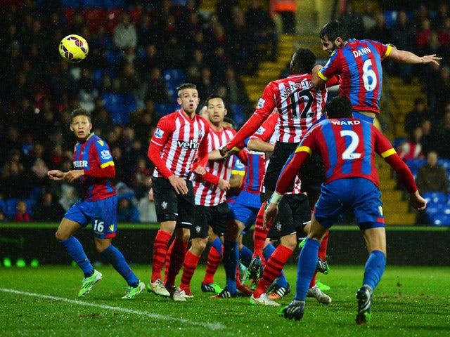 Scott Dann of Crystal Palace scores their first goal with a header during the Barclays Premier League match between Crystal Palace and Southampton at Selhurst Park on December 26, 2014