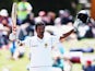 Dimuth Karunaratne of Sri Lanka celebrates after scoring a century during day three of the First Test match between New Zealand and Sri Lanka at Hagley Oval on December 28, 2014 