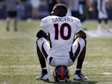 Wide receiver Emmanuel Sanders #10 of the Denver Broncos sits on his helmet before the game against the Seattle Seahawks at CenturyLink Field on September 21, 2014