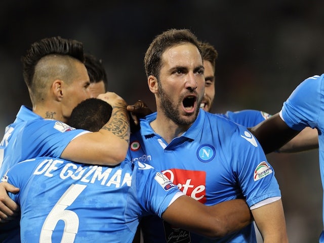 Napoli's Argentine striker Gonzalo Higuain (C) celebrates with teammates after scoring during their Italian Super Cup football match against Juventus on December 22, 2014