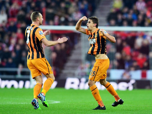 Gaston Ramirez of Hull City celebrates with teammate David Meyler of Hull City after scoring a goal to level the scores at 1-1 during the Barclays Premier League match between Sunderland and Hull City at the Stadium of Light on December 26, 2014