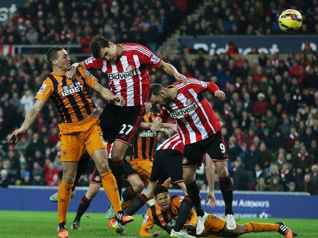 Hull City's English defender James Chester scores their second goal during the English Premier League football match between Sunderland and Hull City at The Stadium of Light in Sunderland, north east England on December 26, 2014