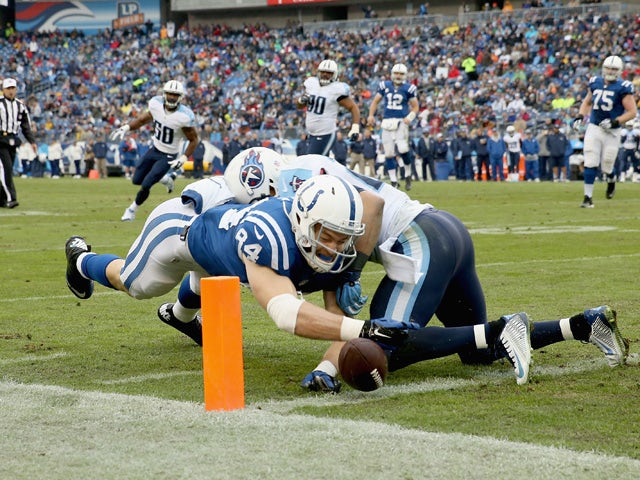 Jack Doyle #84 of the Indianapolis Colts reaches to score a touchdown during the game against the Tennessee Titans at LP Field on December 28, 2014