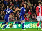 Chelsea player John Terry (c) celebrates after scoring the opening goal during the Barclays Premier League match against Stoke City on December 22, 2014