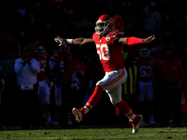 Outside linebacker Justin Houston #50 of the Kansas City Chiefs reacts after making a sack during the first half of the game against the San Diego Chargers at Arrowhead Stadium on December 28, 2014