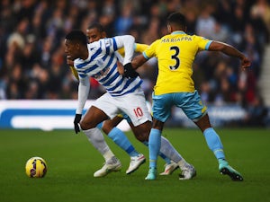 Leroy Fer of QPR evades Adrian Mariappa of Crystal Palace during the Barclays Premier League match on December 28, 2014