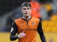 Young Wolverhampton Wanderers striker Liam McAlinden heads for Crawley Town