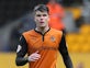 Young Wolverhampton Wanderers striker Liam McAlinden heads for Crawley Town