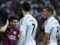 Barcelona's Lionel Messi stands next to Real Madrid duo Cristiano Ronaldo and Toni Kroos during the 'El Clasico' La Liga match on October 25, 2014