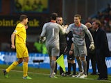 Goalkeeper Brad Jones of Liverpool is replaced by Simon Mignolet of Liverpool as Steven Gerrard talks to Brendan Rodgers, manager of Liverpool during the Barclays Premier League match between Burnley and Liverpool at Turf Moor on December 26, 2014 
