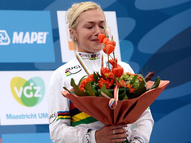 Britain's Lucy Garner celebrates on the podium after winning the women's Junior Road race World Championships on September 21, 2012